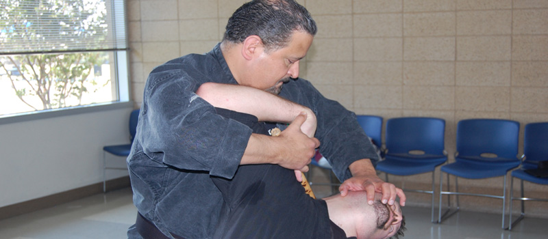 picture of Professor Israel Gonzales applying archer technique